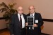 Dr. Nagib Callaos, General Chair, giving Dr. Mario Lamanna a plaque "In Appreciation for Delivering a Great Keynote Address at a Plenary Session."